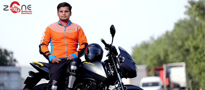 Zone Delivery Services Rider is wearing orange talabat jacket ready for Last Mile Delivery